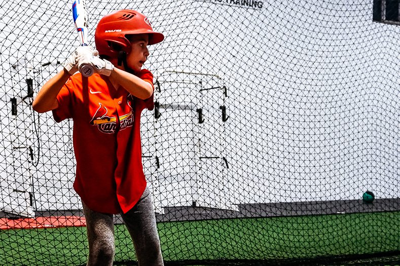 The-Baseball-Zone-kid-holding-baseball-bat